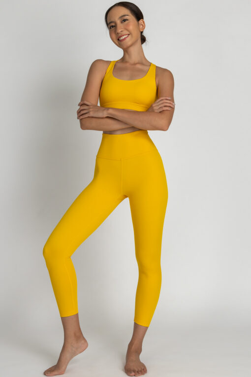 7/8 leggings with matching bra in color mustard front view