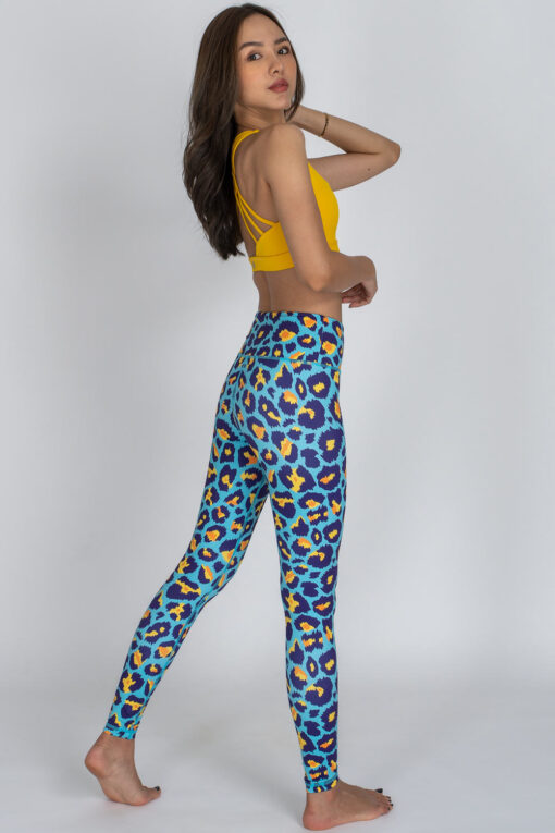 Blue Cheetah full-length Leggings showing the side with yellow top.